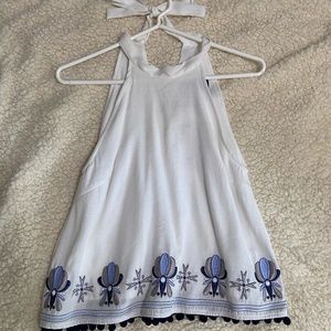 Francesca's Fancy Halter top with sewn detail and pom moms